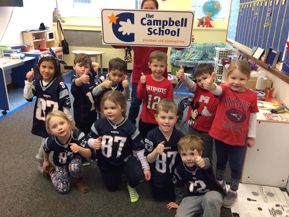 Campbell School preschoolers holding the school sign