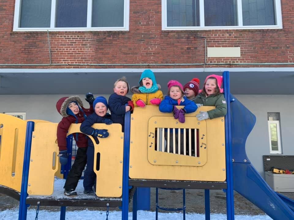 Children playing outdoors at The Campbell School