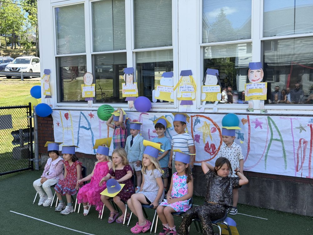 Children celebrating together in the classroom at The Campbell School